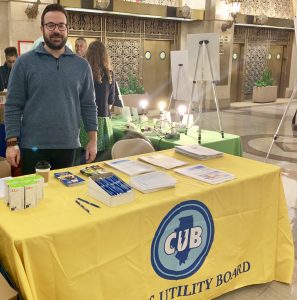 Matt from CUB's Outreach team hands out money-saving tips at a tabling event.
