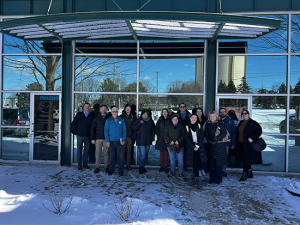 Group photo of CUB Staff, volunteers, and partners at the Midwest Renewable Energy Association visiting Mitsubishi’s training center to learn more about Air Source Heat Pumps.